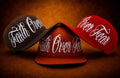Faith Over Fear embroidered hats in burnt orange, chocolate brown, and red